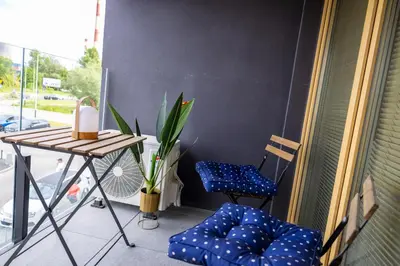 a balcony with a table and two chairs and a table at Imperial Citi Yes Apartament in Kraków