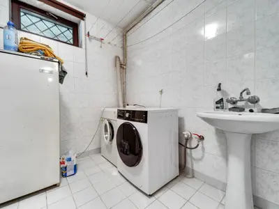 a washing machine in a bathroom next to a sink at Apartment Marcyporęba by Interhome in Marcyporęba