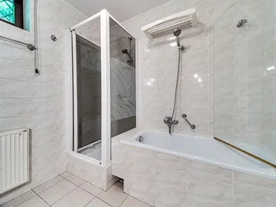 a bathroom with a shower and a bath tub at Apartment Marcyporęba by Interhome in Marcyporęba