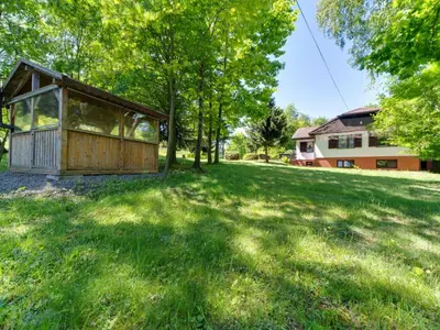 a house in the middle of a grassy field at Apartment Marcyporęba by Interhome in Marcyporęba