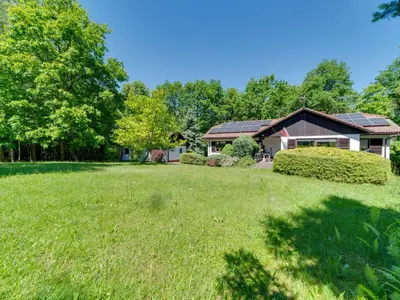 a home with a large yard in front of a house at Apartment Marcyporęba by Interhome in Marcyporęba