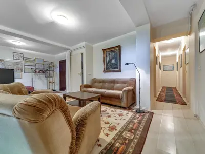 a living room with couches and a table and a couch at Apartment Marcyporęba by Interhome in Marcyporęba