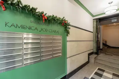 a front door of a building with christmas decorations at Studio apartment - Rakowicka 14 Street in Kraków