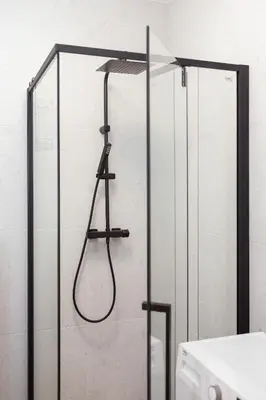 a shower in a bathroom with a glass door at Studio apartment - Rakowicka 14 Street in Kraków