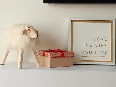 a cat toy next to a box and a picture at Coco Chanel Cosy 45 m2 city centre fast wifi in Kraków