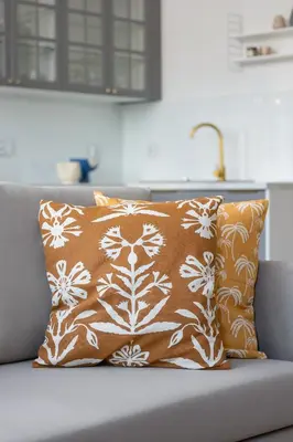 a pillow on a couch in a living room at Apartment - Plac Wolnica 12A in Kraków