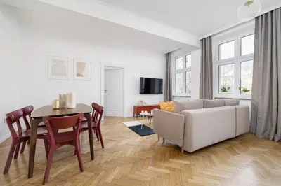 a living room with a couch and a table at Apartment - Plac Wolnica 12A in Kraków