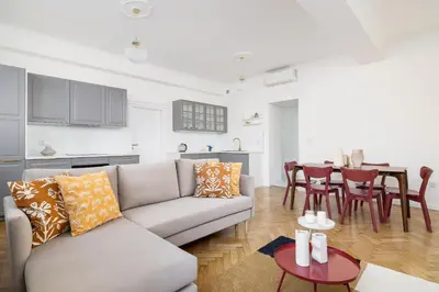 a living room with a couch and a table at Apartment - Plac Wolnica 12A in Kraków