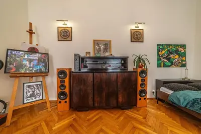 a living room filled with speakers and a tv at Climatic studio for 2-4 person in Main Square in Kraków