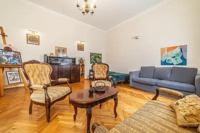 a living room with a couch and a table at Climatic studio for 2-4 person in Main Square in Kraków