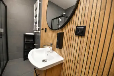 a bathroom with a shower and a toilet and a sink at Sunset by Housine in Zator