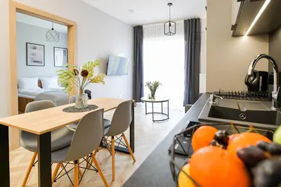 a living room with a couch and a table at Sunset by Housine in Zator