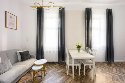 a living room with a couch and a table at Native Apartments Smoleńsk 33 in Kraków