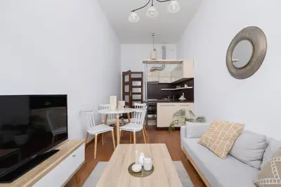 a living room with a couch and a table at Wielopole 7 - 1 bedroom - OLD TOWN in Kraków