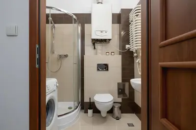 a small bathroom with a toilet and a sink at Wielopole 7 - 1 bedroom - OLD TOWN in Kraków