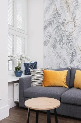 a living room with a couch and a table at Apartment with balcony - Kazimierz- Starowislna 43 in Kraków