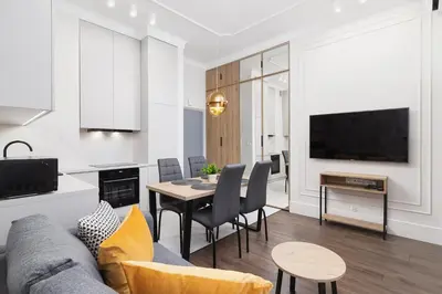 a living room with a couch and a table at Apartment with balcony - Kazimierz- Starowislna 43 in Kraków