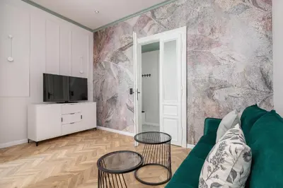 a living room with a couch and a tv at 3 Bedroom Apartment - Dietla 11 in Kraków