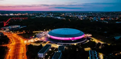 a night view of a soccer stadium with lights at Lema Tauron Arena Two Bedroom Apartment in Kraków