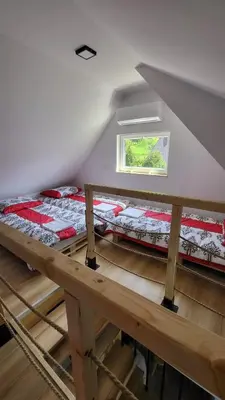 two bunk beds in a room with a window at Stylove Apartamenty in Kocierz Rychwałdzki