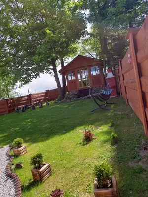 a backyard with a gazebo and some plants at DOMEK NA GRANICY wynajem nocleg in Stankowa