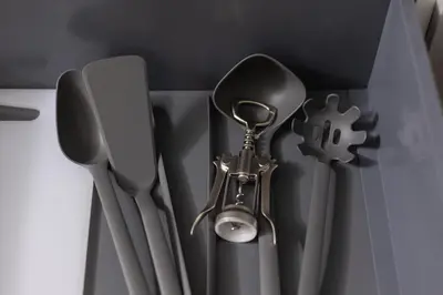 a group of utensils hanging on a wall at Eklsuzywny Apartament z Parkingiem w Krakowie by Renters Prestige in Kraków