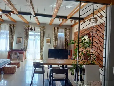 a living room with a table and chairs and a couch at Apartament Deluxe w centrum Brzeska nr 2 in Brzesko
