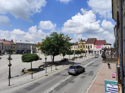 a car driving down a street in a town at Apartament Deluxe w centrum Brzeska nr 2 in Brzesko