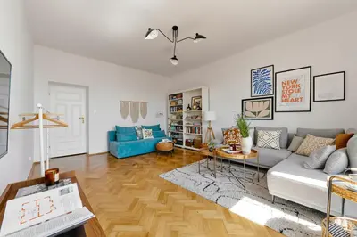 a living room with a couch and a table at Funky Flat Krakow in Kraków