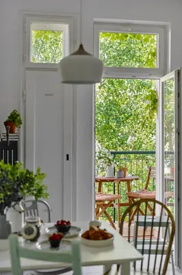 a table with a plate of food on it in a room at Funky Flat Krakow in Kraków