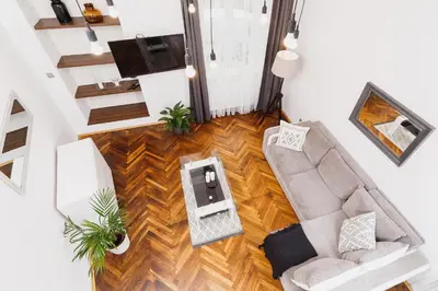 an overhead view of a living room with a couch and a table at Kazimierz - 34 Dietla street in Kraków