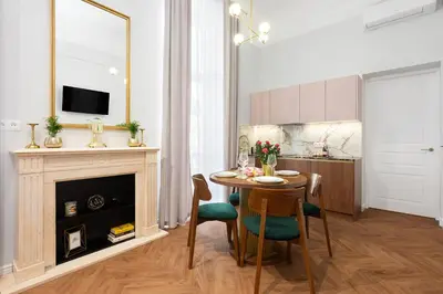 a living room with a table and a fireplace at Old Town K34 by M Apartments in Kraków