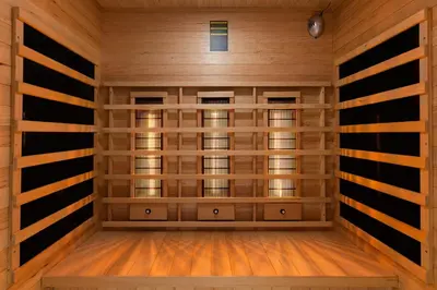 a sauna with wooden walls and wood flooring at Old Town K34 by M Apartments in Kraków
