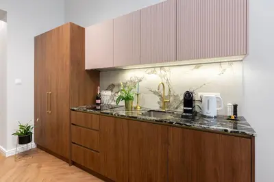 a kitchen with a sink and a counter top at Old Town K34 by M Apartments in Kraków
