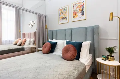 a bedroom with a bed with two pillows on it at Old Town K34 by M Apartments in Kraków
