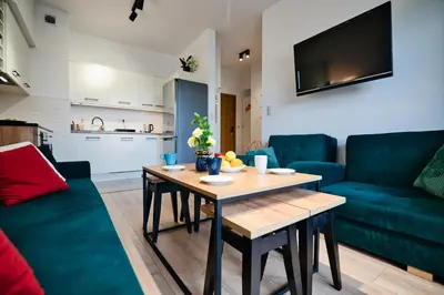 a living room with a table and a couch at Dolce Vita by Housine in Zator