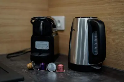 a coffee maker sitting on top of a counter at Saska Park Apartments in Kraków