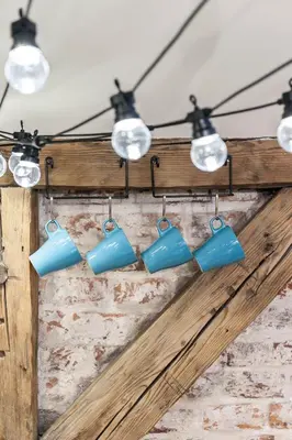 a group of blue lights hanging from a ceiling at Kazimierz District - Dietla 51 street in Kraków