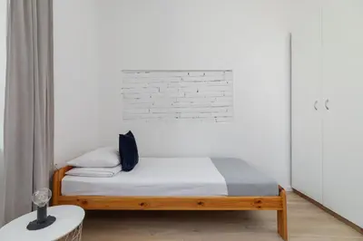 a bathroom with a shower and a toilet and a sink at 3-bedroom apartment - 51 Dietla street in Kraków