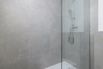 a bedroom with two beds and a dining room with a table at 3-bedroom apartment - 51 Dietla street in Kraków