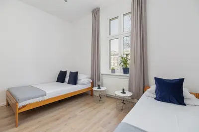 a kitchen with white cabinets and a stove at 3-bedroom apartment - 51 Dietla street in Kraków