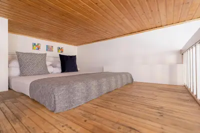 a kitchen with a sink and a wooden door at 3-bedroom apartment - 51 Dietla street in Kraków