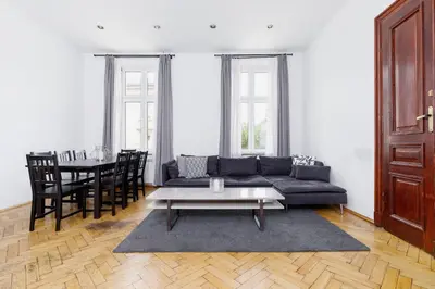 a living room with a couch and a table at Two Bedroom Apartment - Dietla 51 street in Kraków