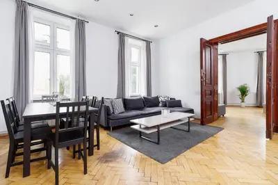 a living room with a couch and a table at Two Bedroom Apartment - Dietla 51 street in Kraków