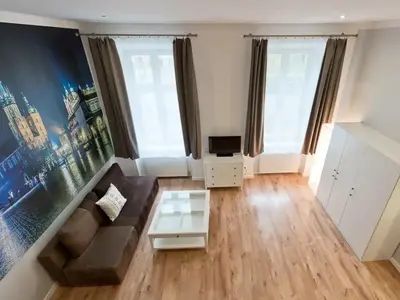 a living room with a couch and a table at 2-bedroom apartment - 51 Dietla Street in Kraków