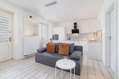 a living room with a couch and a table at One bedroom apartment in the centre - Sarego 16 in Kraków