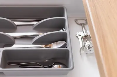 a drawer with silver utensils in it at Apartment with balcony Kalwaryjska 34 street in Kraków