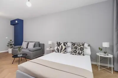 a living room with a bed and a couch at Apartment with balcony Kalwaryjska 34 street in Kraków