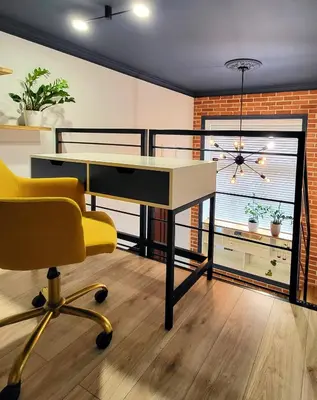 an office with a desk and a chair and a window at Przystań na Kazimierzu in Kraków