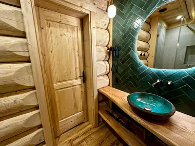 a bathroom with a blue sink and a mirror at Bale na Skale Chata & SPA-Zawoja in Skawica